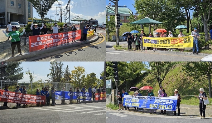 통합반대대책위원회가 1.5km에 달하는 거리에 도열해 윤호중 장관 방문을 환영하고 있다.